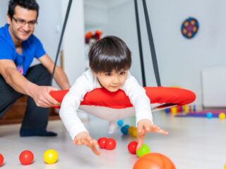 Child engaged in occupational therapy session