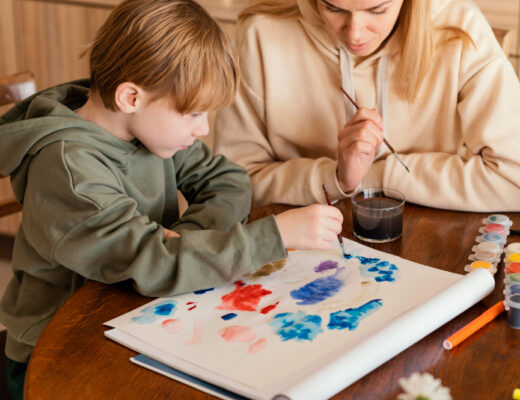 Therapist doing art based therapy with autistic child